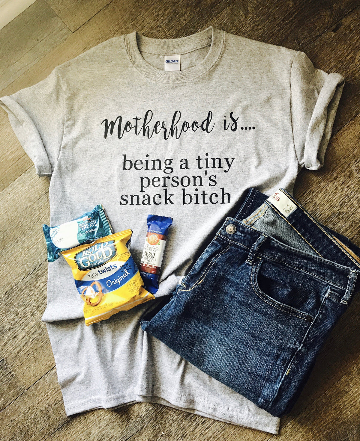 Motherhood is being a tiny persons snack bitch on grey product image 1